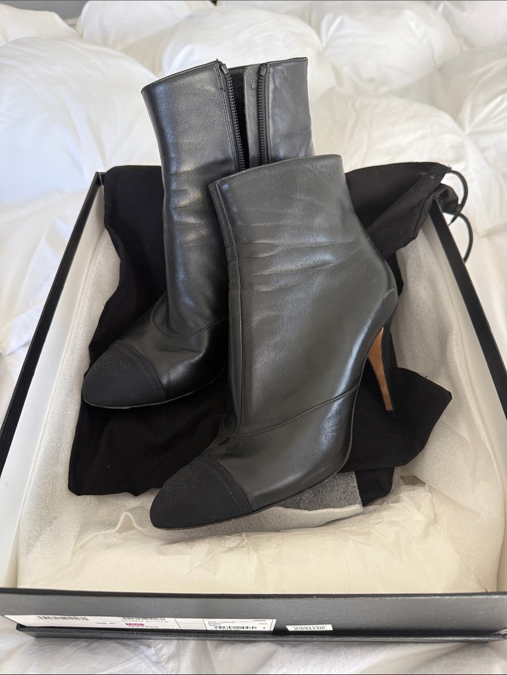 CHANEL Black Leather Ankle Boots with Cap Toe